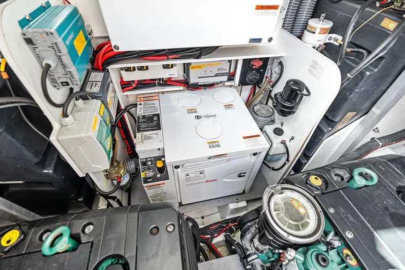 Two Segals Yacht Photos Pics Engine room of 2019 Beneteau Gran Turismo 46 with electrical components and wiring.