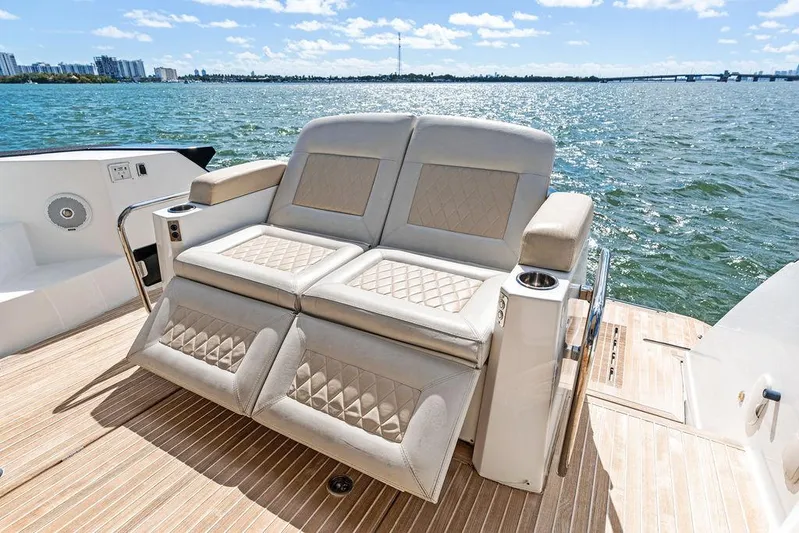 Two Segals Yacht Photos Pics 2019 Beneteau Gran Turismo 46 yacht with luxurious deck seating overlooking the water.