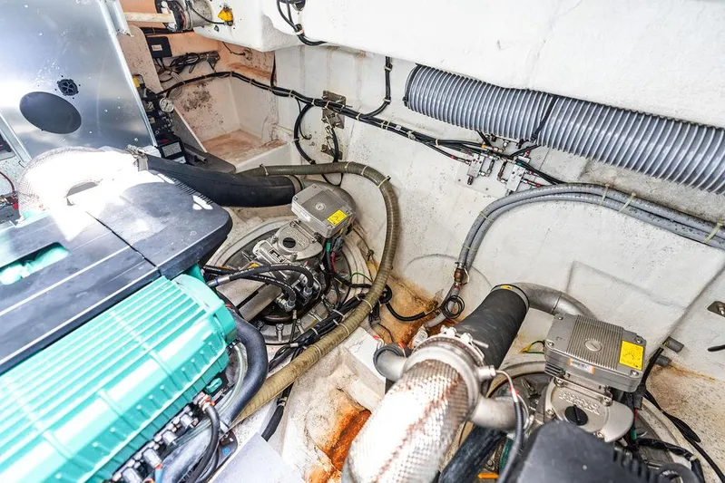 Two Segals Yacht Photos Pics Engine room of 2019 Beneteau Gran Turismo 46 yacht, showcasing mechanical components and wiring.