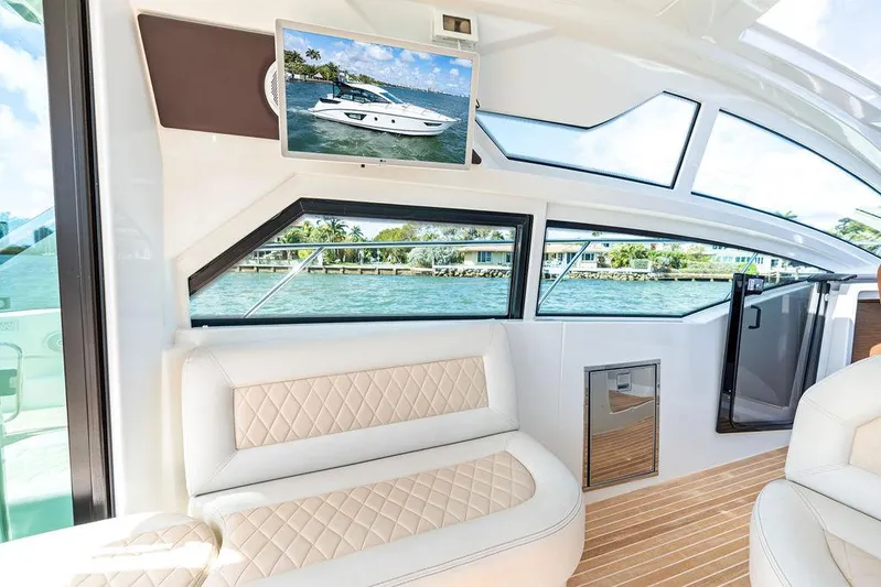 Two Segals Yacht Photos Pics Luxurious interior of 2019 Beneteau Gran Turismo 46 yacht with elegant seating and scenic views.