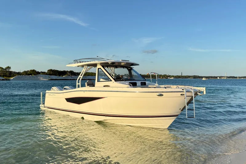  Yacht Photos Pics 2025 Solara S-310 CW boat on clear water under blue sky.