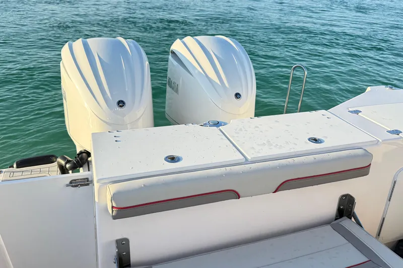  Yacht Photos Pics 2025 Solara S-310 CW boat with dual engines on calm water.