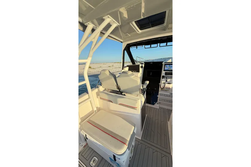  Yacht Photos Pics Interior of 2025 Solara S-310 CW boat with modern seating and navigation equipment.