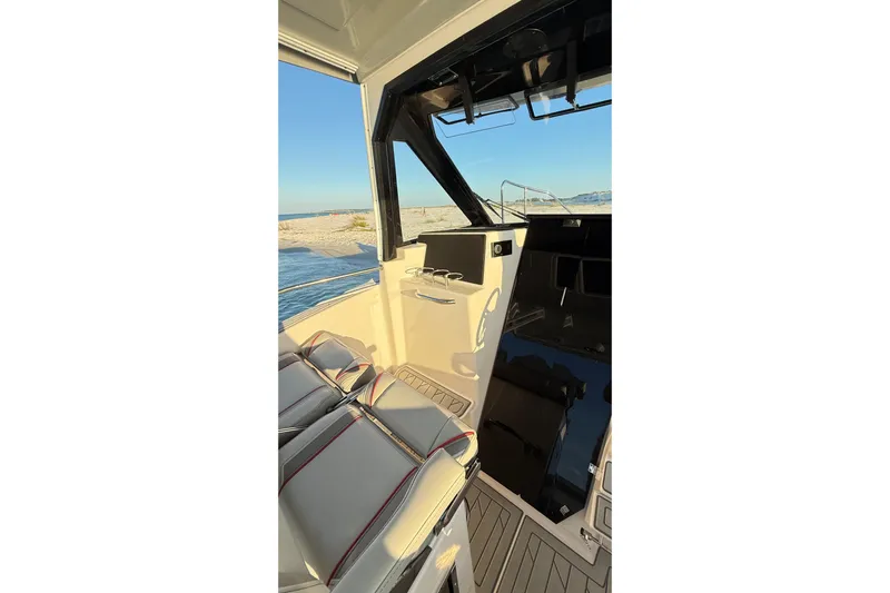  Yacht Photos Pics Interior view of 2025 Solara S-310 CW boat, featuring sleek seating and modern design.