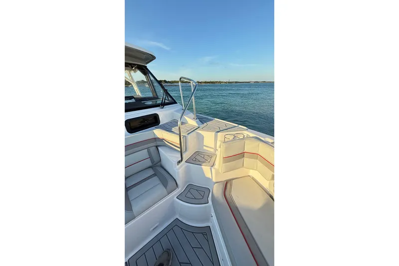  Yacht Photos Pics 2025 Solara S-310 CW boat interior with seating, overlooking calm waters.