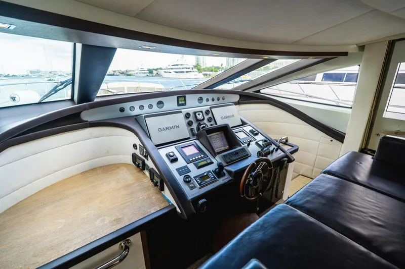  Yacht Photos Pics Cockpit of 2010 Azimut 86S yacht with Garmin navigation system and leather seating.