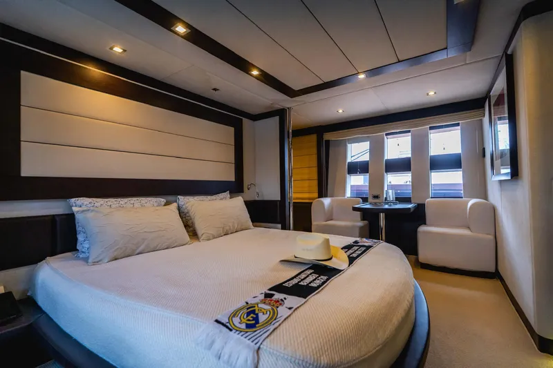  Yacht Photos Pics Luxurious bedroom interior of 2010 Azimut 86S yacht with modern furnishings and elegant design.
