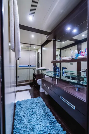  Yacht Photos Pics Luxurious bathroom on 2010 Azimut 86S yacht with modern fixtures and blue rug.