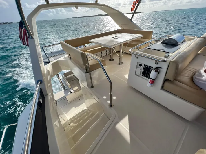 Gr8 Day Yacht Photos Pics Aquila 44 Yacht 2018 deck with seating, table, and ocean view.
