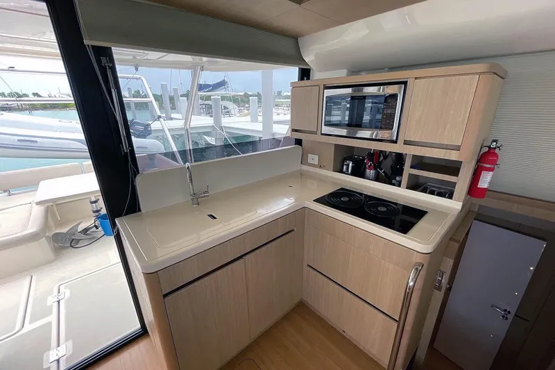 Gr8 Day Yacht Photos Pics Modern kitchen in 2018 Aquila 44 Yacht with stove, sink, and microwave.