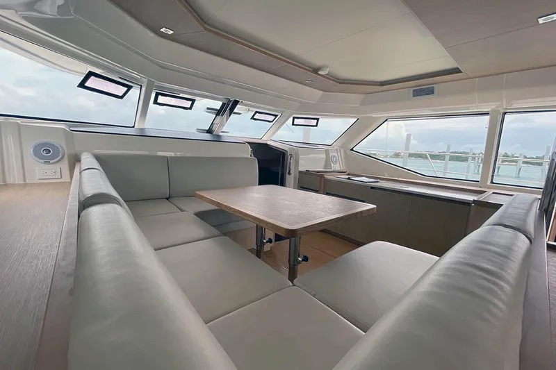 Gr8 Day Yacht Photos Pics Luxurious interior of 2018 Aquila 44 Yacht with panoramic windows and plush seating.