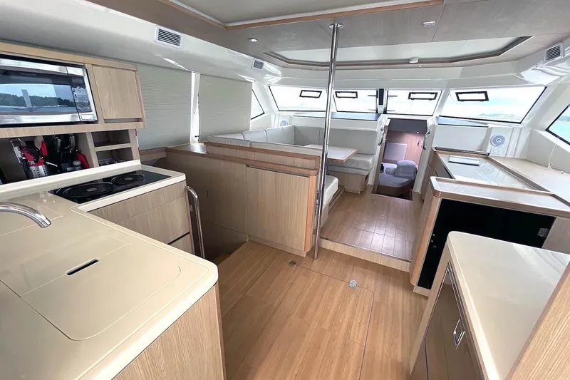 Gr8 Day Yacht Photos Pics Interior of 2018 Aquila 44 Yacht with modern kitchen and seating area.