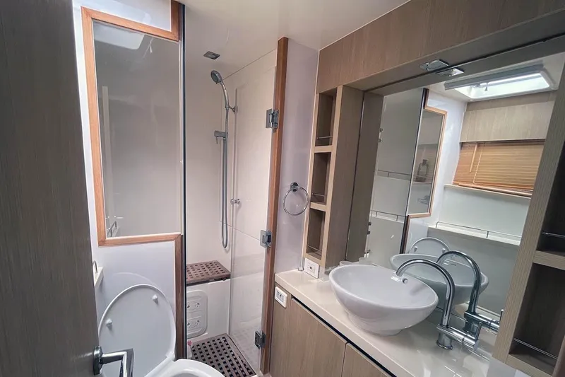 Gr8 Day Yacht Photos Pics Modern bathroom in 2018 Aquila 44 Yacht with shower, sink, and toilet.