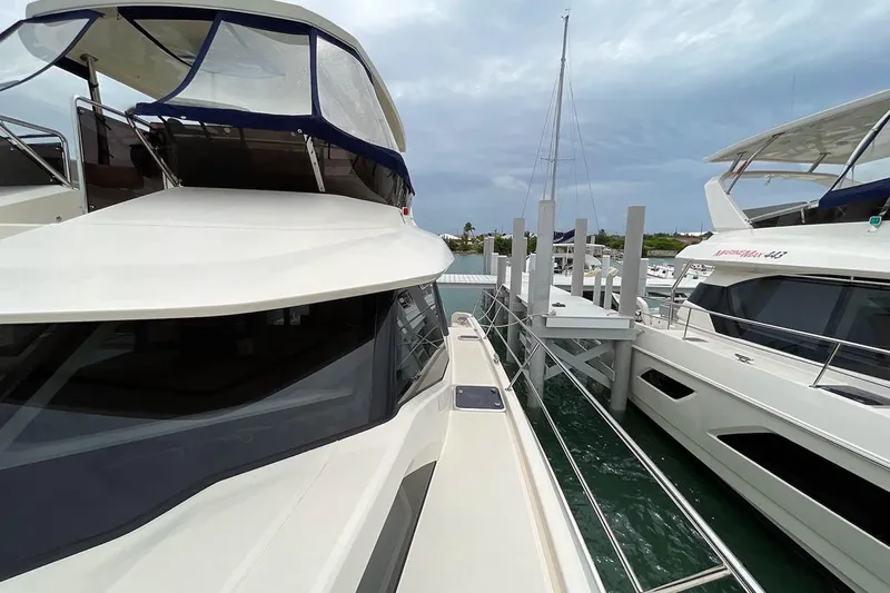 Gr8 Day Yacht Photos Pics 2018 Aquila 44 Yacht docked at marina, showcasing sleek design and spacious deck.