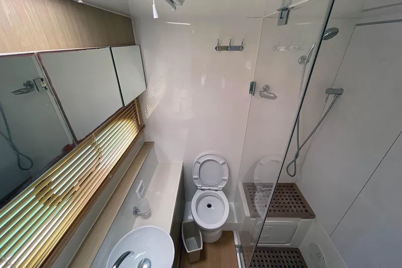 Gr8 Day Yacht Photos Pics Modern bathroom in 2018 Aquila 44 Yacht with shower, toilet, and sink.