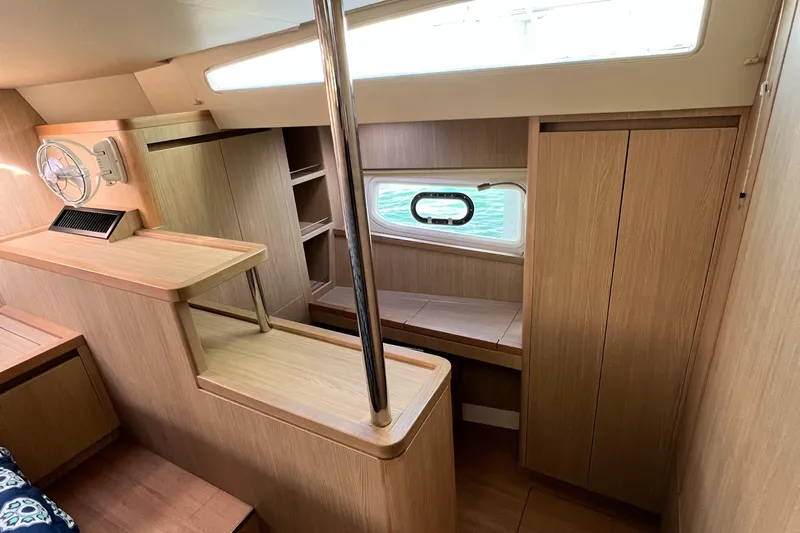 Gr8 Day Yacht Photos Pics Interior of 2018 Aquila 44 Yacht with wooden cabinetry and seating area.