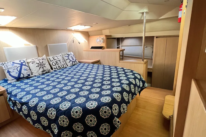 Gr8 Day Yacht Photos Pics Luxurious 2018 Aquila 44 Yacht bedroom with nautical-themed decor and cozy bedding.