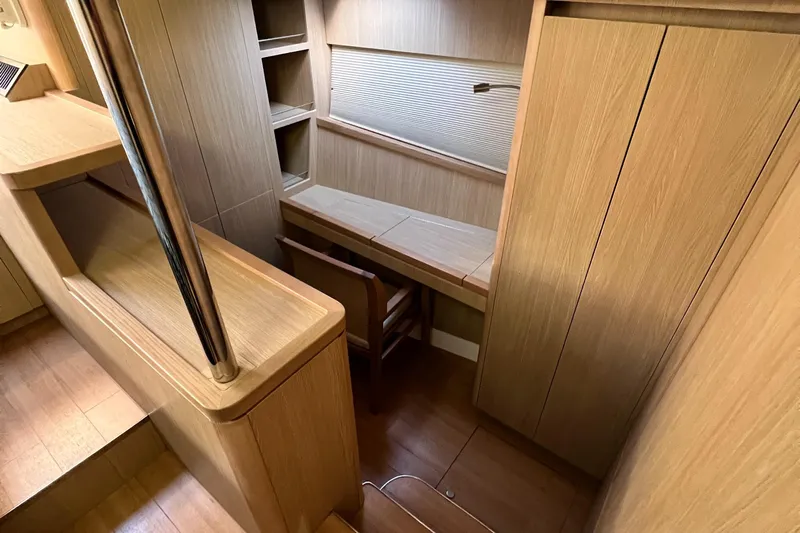 Gr8 Day Yacht Photos Pics Interior of 2018 Aquila 44 Yacht with wooden desk and shelving.