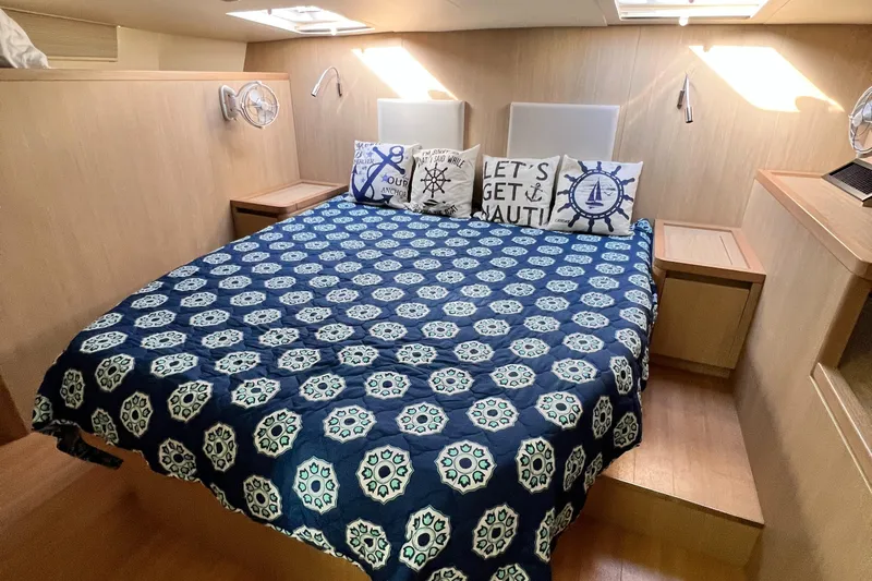 Gr8 Day Yacht Photos Pics Luxurious bedroom interior of 2018 Aquila 44 Yacht with nautical-themed decor.