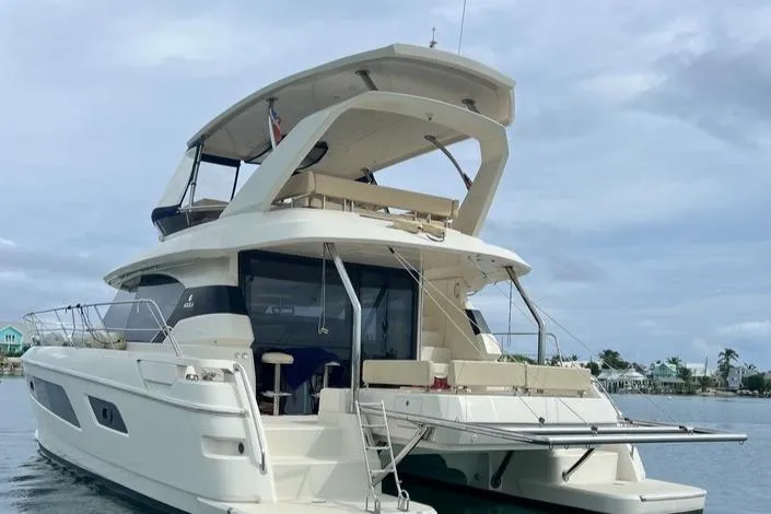 Gr8 Day Yacht Photos Pics 2018 Aquila 44 Yacht on calm water, featuring spacious deck and modern design.