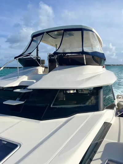 Gr8 Day Yacht Photos Pics 2018 Aquila 44 Yacht cruising on clear blue waters under a sunny sky.