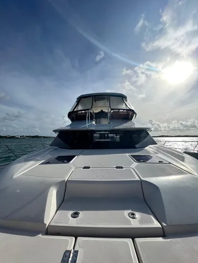 Gr8 Day Yacht Photos Pics 2018 Aquila 44 Yacht on water under a bright sky.