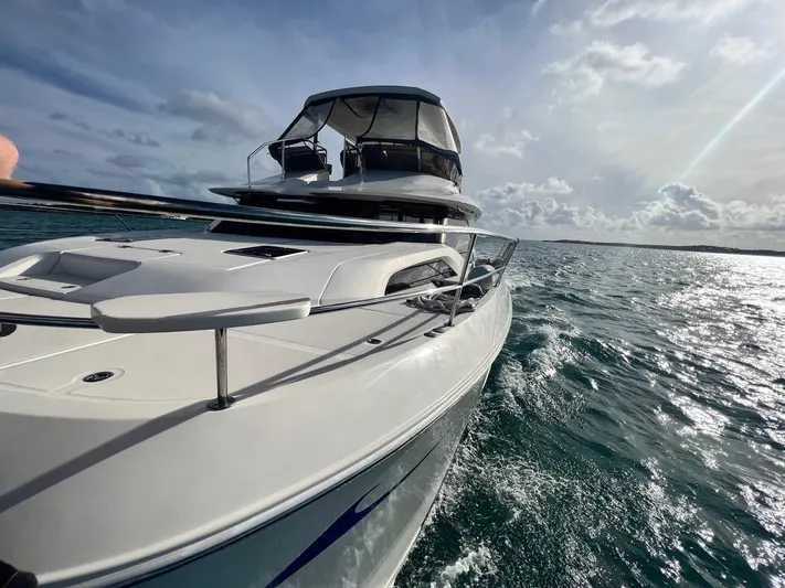 Gr8 Day Yacht Photos Pics Aquila 44 Yacht 2018 cruising on open water under a cloudy sky.