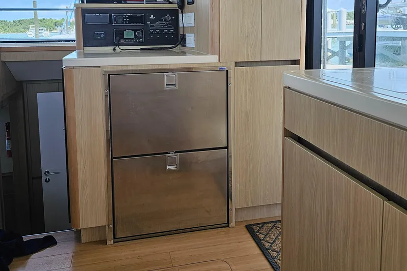 Gr8 Day Yacht Photos Pics Interior of 2018 Aquila 44 Yacht with modern cabinetry and stainless steel appliances.