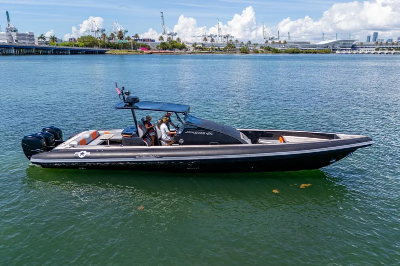 Fightertown Yacht Photos Pics 2019 Technohull OMEGA 45 boat on water, featuring sleek design and powerful engines.