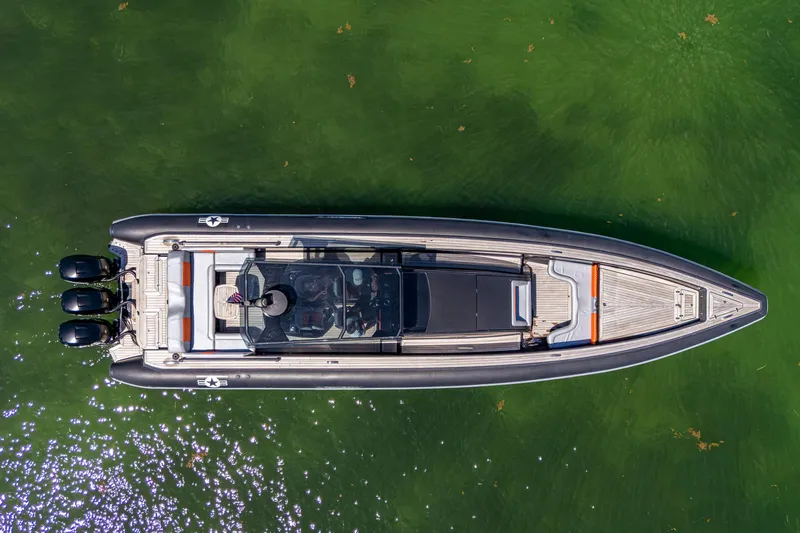 Fightertown Yacht Photos Pics Aerial view of 2019 Technohull OMEGA 45 boat on green water.