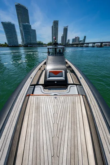 Fightertown Yacht Photos Pics 2019 Technohull OMEGA 45 boat on water with city skyline background.