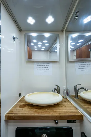 Fightertown Yacht Photos Pics Technohull OMEGA 45 bathroom with wooden countertop and modern sink, 2019 model.