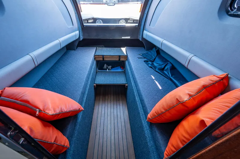 Fightertown Yacht Photos Pics Interior cabin of 2019 Technohull OMEGA 45 with orange cushions and sleek design.