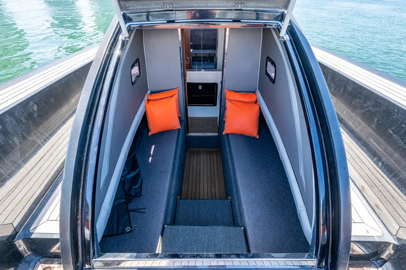 Fightertown Yacht Photos Pics 2019 Technohull OMEGA 45 cabin interior with orange cushions and sleek design.