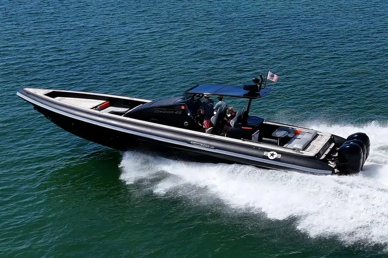 Fightertown Yacht Photos Pics 2019 Technohull OMEGA 45 speedboat cruising on open water, showcasing sleek design and powerful engines.