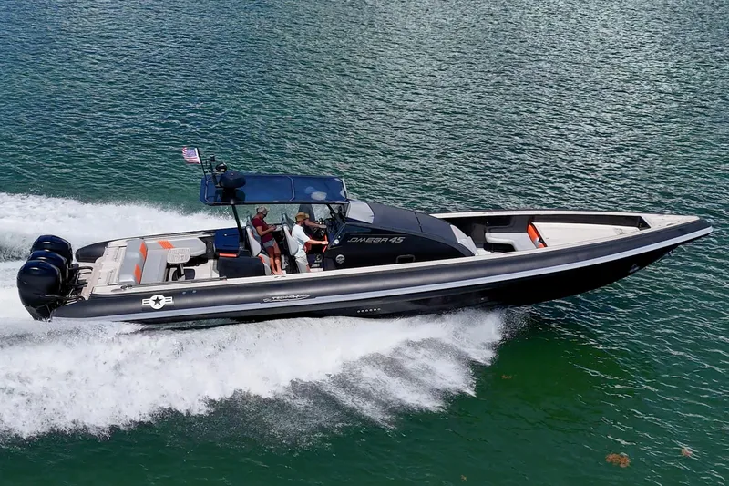 Fightertown Yacht Photos Pics 2019 Technohull OMEGA 45 speedboat cruising on water with passengers onboard.