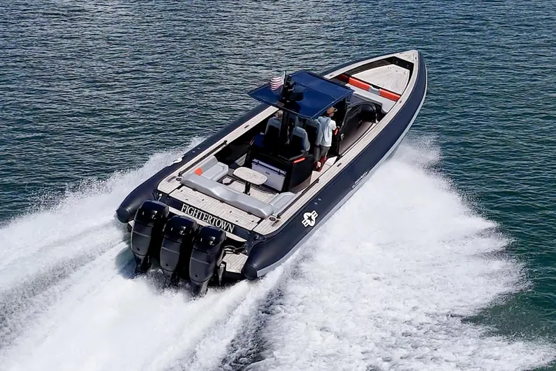 Fightertown Yacht Photos Pics 2019 Technohull OMEGA 45 speedboat cruising on water with powerful engines.