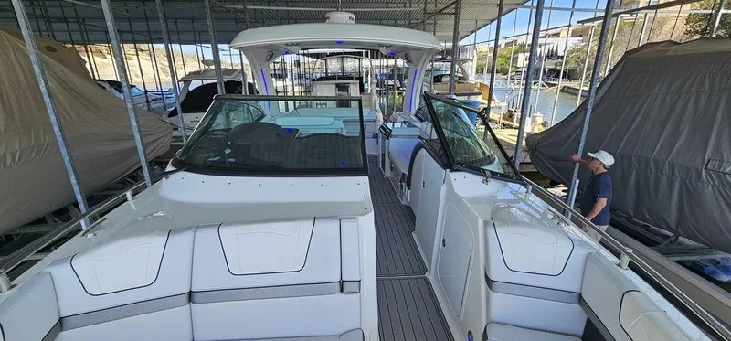  Yacht Photos Pics 2021 Formula 350 Crossover Bowrider in marina, showcasing sleek design and spacious seating.