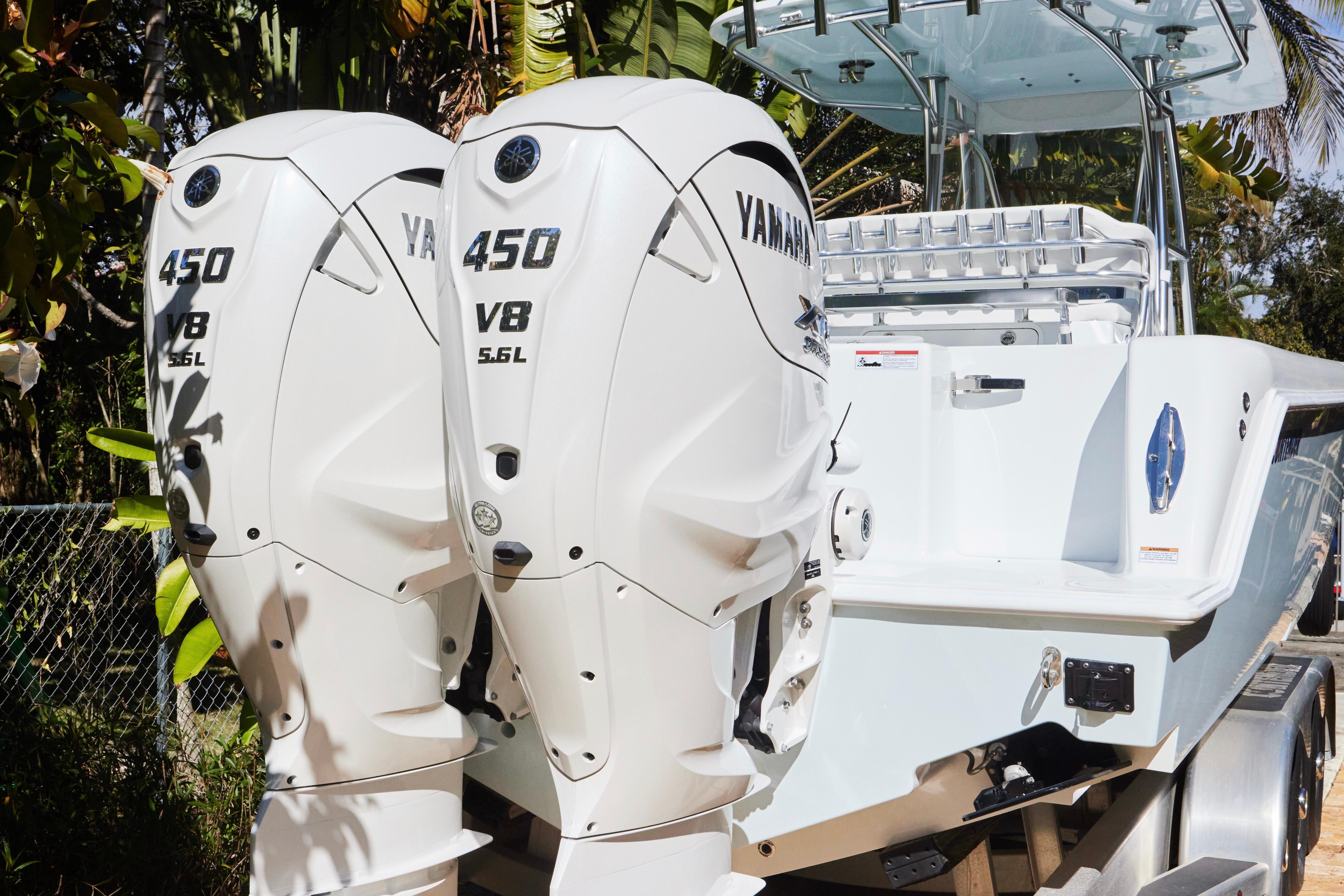 2024 Contender 35 ST boat with dual Yamaha 450 V8 engines, rear view.