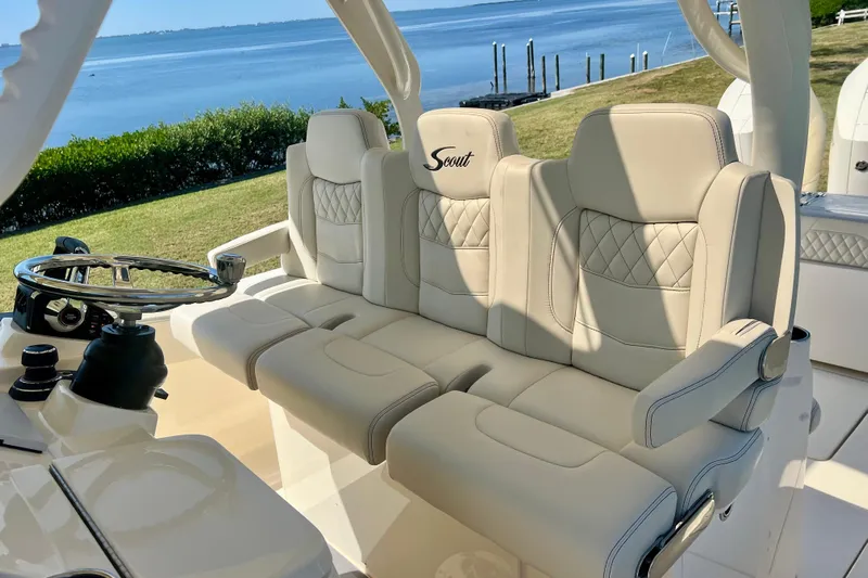  Yacht Photos Pics Luxurious seating on 2026 Scout 357 LXF boat with scenic waterfront view.
