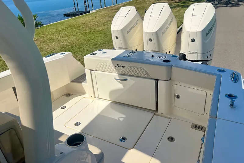  Yacht Photos Pics 2026 Scout 357 LXF boat with triple Mercury engines, docked by the water.