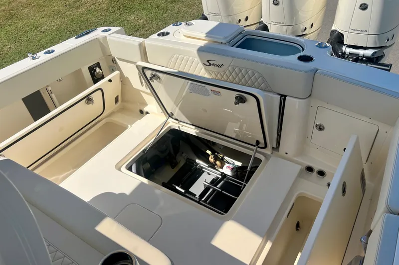 Yacht Photos Pics 2026 Scout 357 LXF boat interior with open storage compartments and engine access.