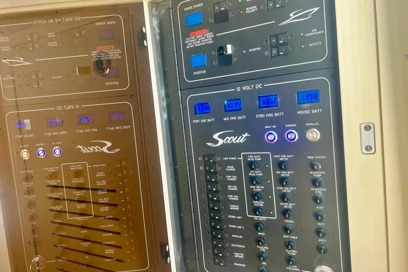  Yacht Photos Pics Control panel of 2026 Scout 357 LXF boat with various switches and indicators.