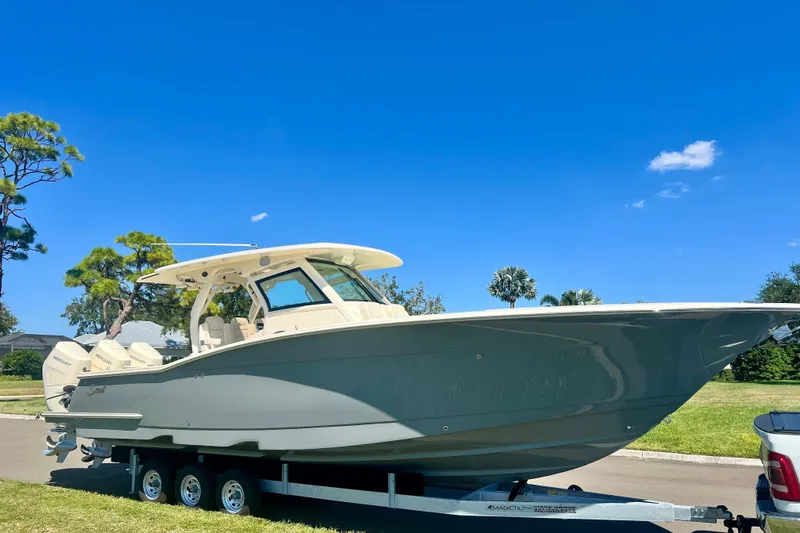 Yacht Photos Pics 2026 Scout 357 LXF boat on trailer under clear blue sky.