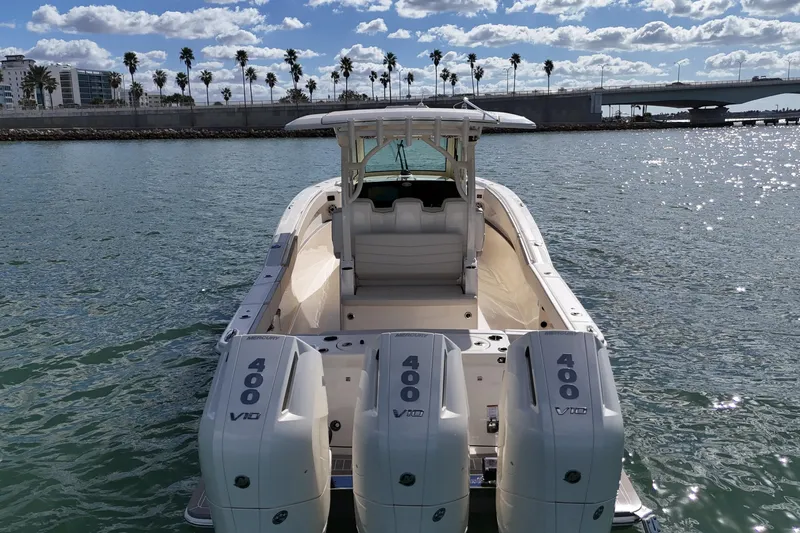  Yacht Photos Pics 2026 Scout 357 LXF boat with triple 400 V10 engines on sunny water.