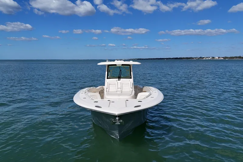  Yacht Photos Pics 2026 Scout 357 LXF boat on calm blue water under a clear sky.