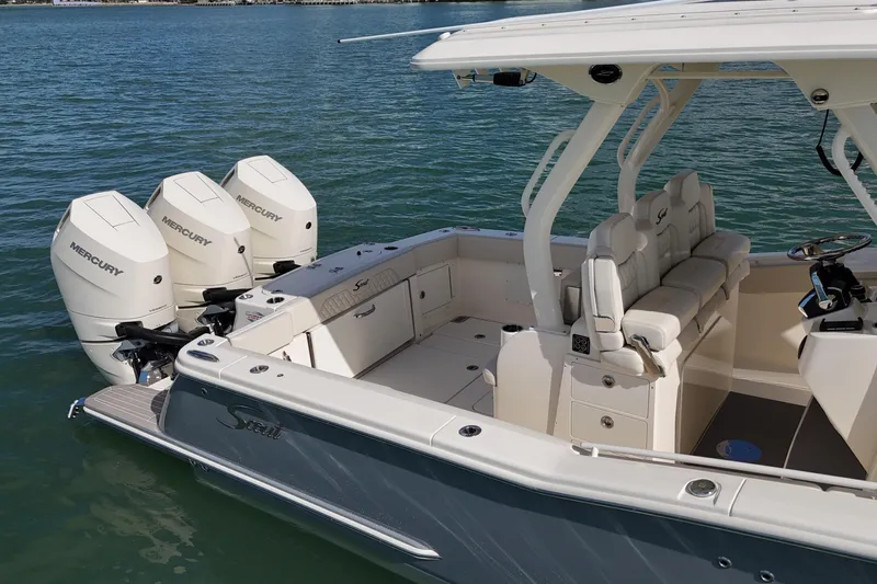  Yacht Photos Pics 2026 Scout 357 LXF boat with triple Mercury engines on calm water.