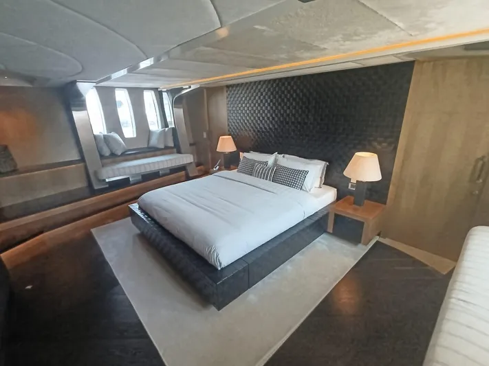 Gamma Yacht Photos Pics Luxurious bedroom interior on a 2007 Pershing 115 yacht with modern decor.