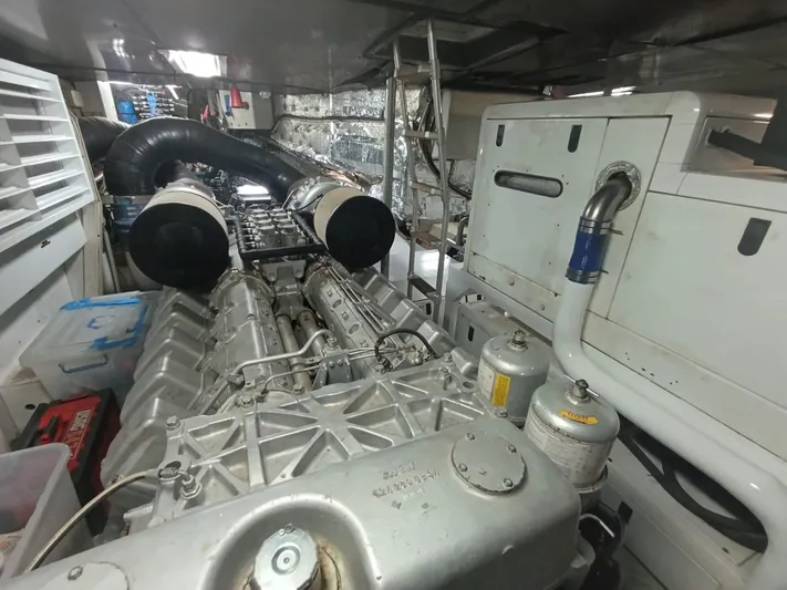 Gamma Yacht Photos Pics Engine room of a 2007 Pershing 115 yacht, showcasing powerful machinery and components.