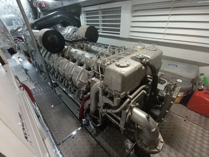 Gamma Yacht Photos Pics Engine room of a 2007 Pershing 115 yacht, showcasing a powerful marine engine.